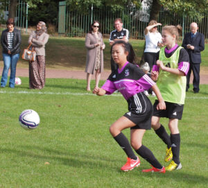 Girls playing football