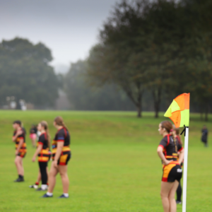 Image of youth female rugby players on a rugby pitch