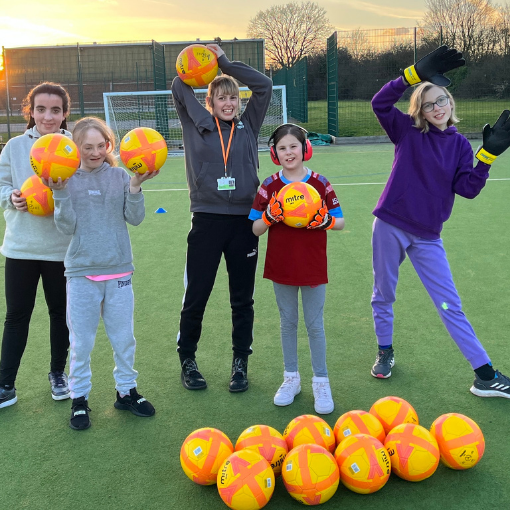 Group of girls with footballs
