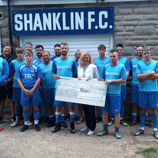 Group being presented with a cheque