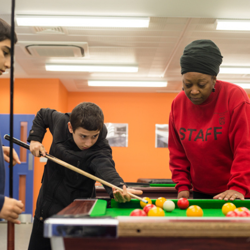 Young people playing snooker