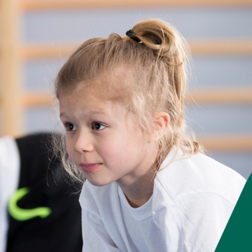 Face of a young girl in a press-up position