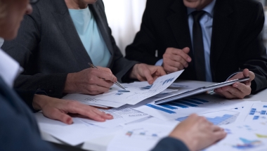 two people looking at documents