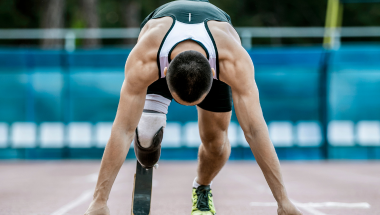 amputee sprinter about to set off on a running track